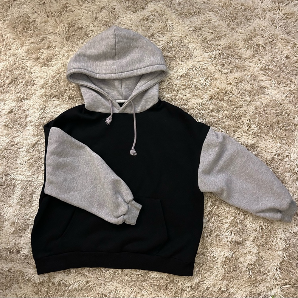 Black hoodie with grey sleeves and hood in size medium